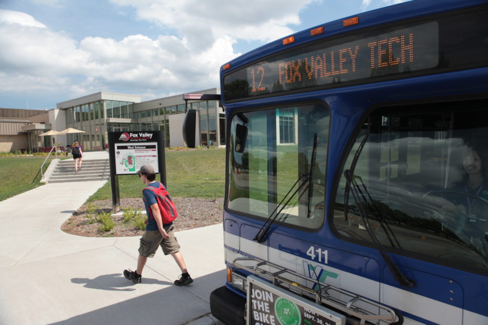 Person walking away from bus