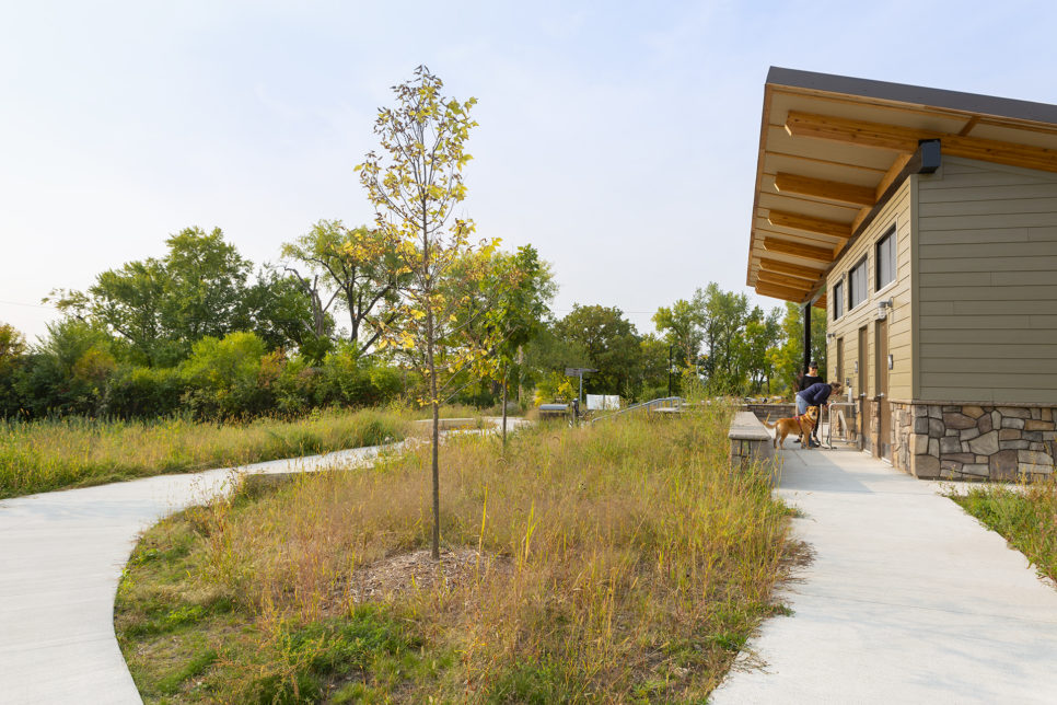 People using drinking fountain at new park shelter