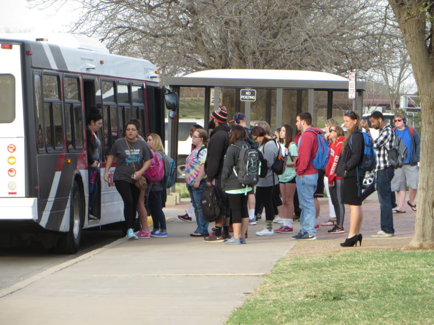 Students getting onto bus at Texas Tech