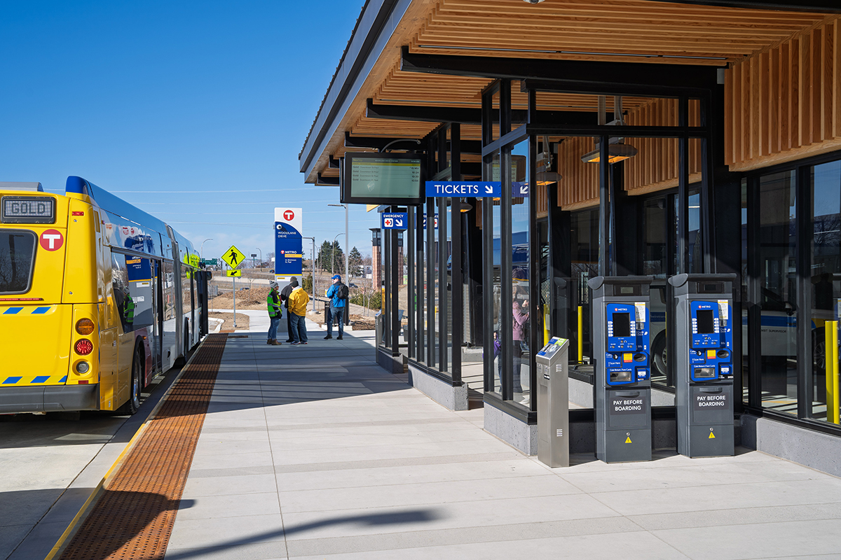 METRO Gold Line BRT Woodlane Station and surrounding urban streetscape in Minnesota.
