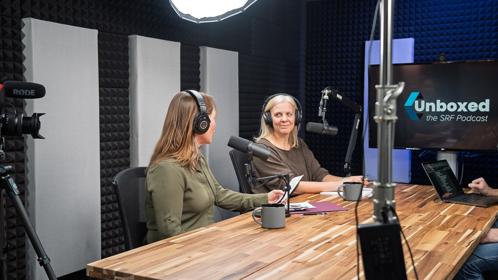 Cassie Champion and Abby Moore sitting in SRF's multimedia studio.